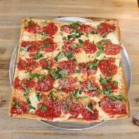 Square Grandma Pizza · Fresh mozzarella, tomato sauce, olive oil and basil.