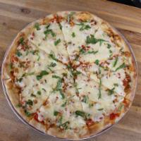 Round Chicken Parm Pizza · Cheese, tomato sauce, fried chicken, grated cheese Parmesan and basil.