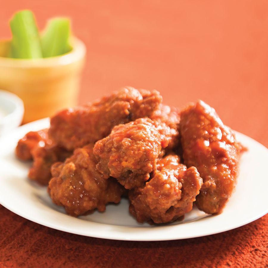 OTB Buffalo Wings · Battered on the bone wings tossed in choice of mild, hot, sweet n spicy, BBQ, teriyaki or Sriracha sauce. Served with a side blue cheese and celery sticks.
