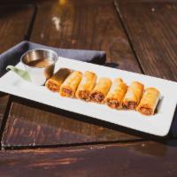 Pork Shanghai Lumpia · Marinated ground pork & with ginger, carrots, onions wrapped in spring roll wrapper served w...