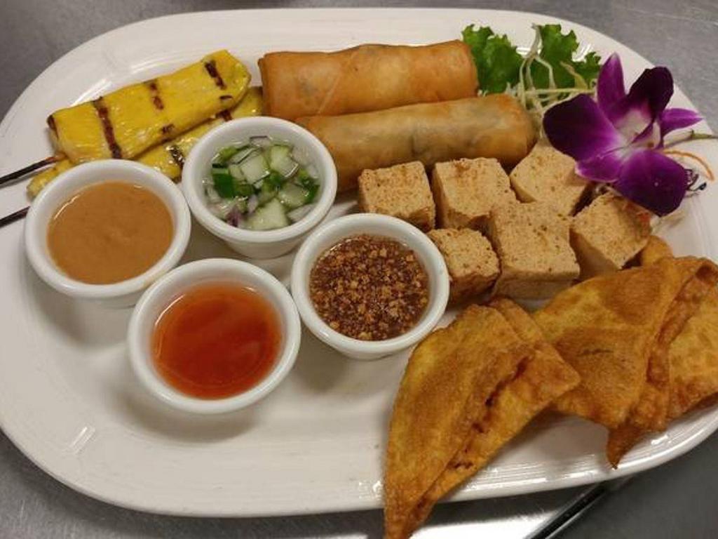 Combination Plate · Our sample platter of poh pia tod, tao hoo tod, chicken satay, and giew tod.