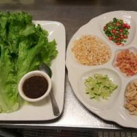 Miang Kum · Green leaf, coconut flakes, peanuts, fresh ginger, shallots, dried shrimp Thai chili, and li...