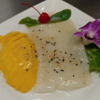 Mango Sticky Rice · This is a traditional Thai dessert made with sweet sticky rice, fresh mango, and coconut milk.