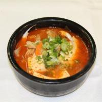 Pork Kimchi Stew 돼지목살김치찌게 · Pork meats, kimchi, tofu, green onions, rice cake, mushroom in spicy broth.