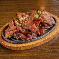 LA Kalbi LA 갈비 구이 · Marinated short ribs. Marinated in house sauce, sweet and savory beef BBQ. Cooked on char-br...