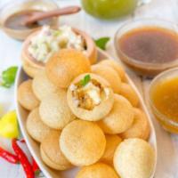Pani Puri · Crispy puris served with filling and spiced water.