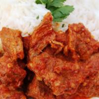 Lamb Vindaloo · Boneless Lamb cooked in spicy vindaloo sauce served with a side of Basmati Rice.