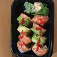 S10. Beauty Alaskan Roll · 8 pieces. Spicy salmon, cucumber rolled inside topped with salmon and avocado tobiko. Raw.