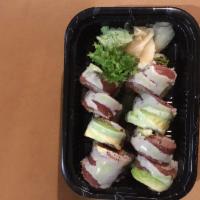 S20. Tuna Amazing Roll · 8 pieces. Spicy tuna, white tuna rolled inside, topped with pepper tuna, avocado, wasabi yuz...