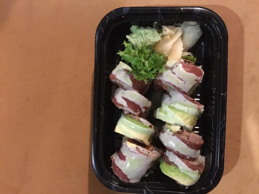 S20. Tuna Amazing Roll · 8 pieces. Spicy tuna, white tuna rolled inside, topped with pepper tuna, avocado, wasabi yuzu. Raw.