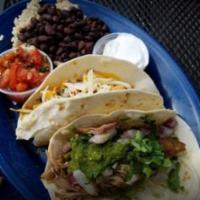 2 Taco Plate · Mix and match any 2 of our Raging Tacos! Served with a garden salad or a side of beans and r...