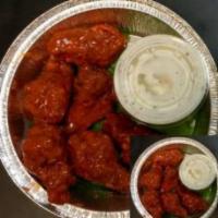 Hot Wings · 6 pieces. Chicken wings deep fried, then dipped in hot sauce.