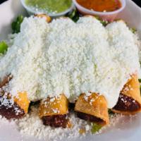 Cheese Flautitas · crispy taquitos stuffed w/ cheese, topped w/ sour cream, cotija cheese, salsa de arbol. serv...