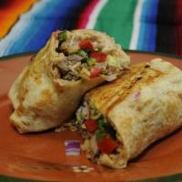 Bistec Burrito · Steak. Large flour tortilla filled with cheese, refried beans, rice, lettuce, tomato, onion,...