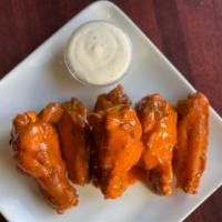 Classic Buffalo Wings · Served with bleu cheese. 7 per order.
