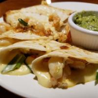 Quesadilla Dinner · Flour tortilla or corn tortilla filled with chihuahua cheese. Side of guacamole and sour cre...