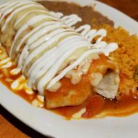 Burrito Suizo Grande · Diced skirt steak, pinto beans, lettuce, tomato, onions, cilantro, topped with entomatada sa...