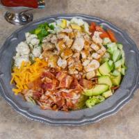 Cobb Salad · On lettuce topped with fresh chicken strips, hard boiled egg, tomatoes, cucumber, cheddar ch...