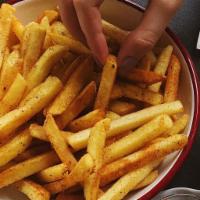 French Fries · Seasoned to perfection with salt and black pepper and served with ketchup  on the side. 