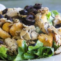 Blackened Chicken Caesar Salad · Romaine lettuce, croutons, black olives, Parmesan cheese with seasoning.  Included a side of...