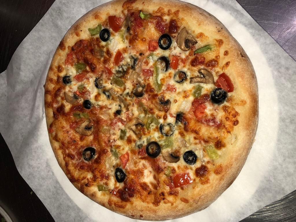 Veggie Supreme Pizza · A garden fresh arrangement of mushrooms, onions, olives, green peppers, tomatoes and extra cheese.