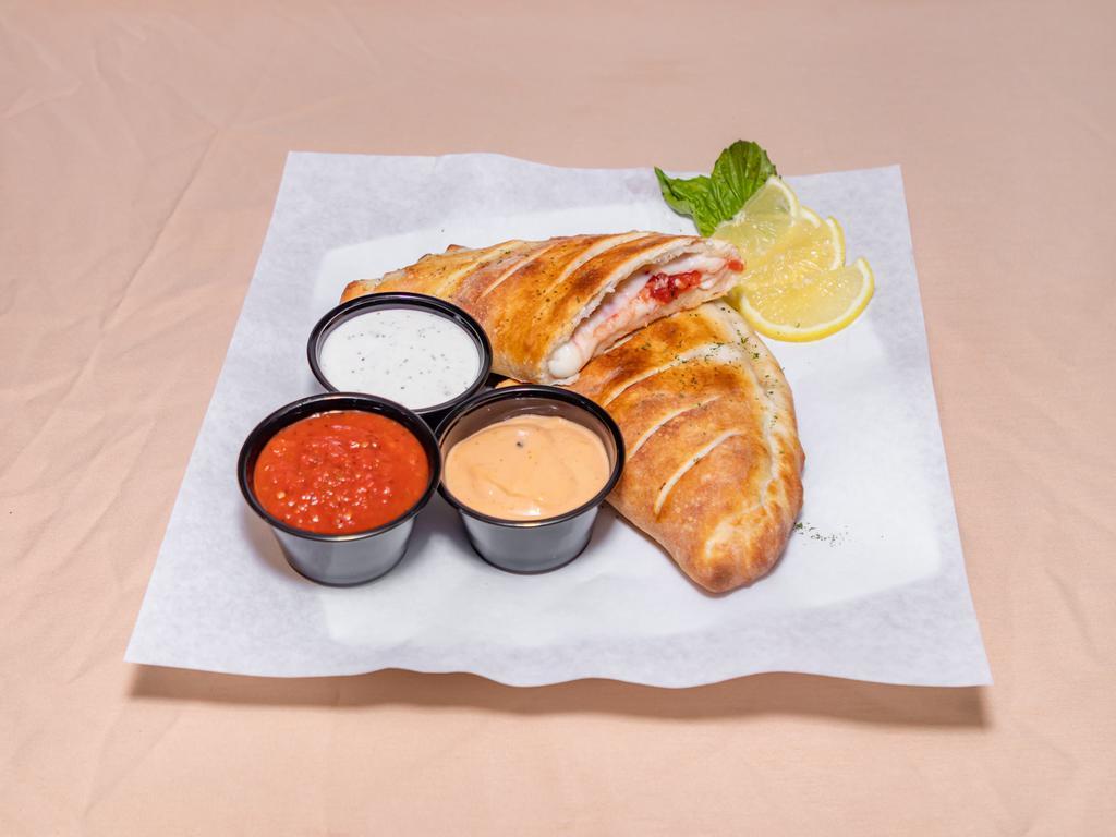 Meatball Calzone · Onions, peppers, cheese and sauce, Includes one marinara on the side for 10