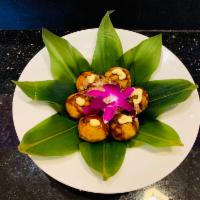 6 Pieces Takoyaki · Ball-shaped octopus dumpling.