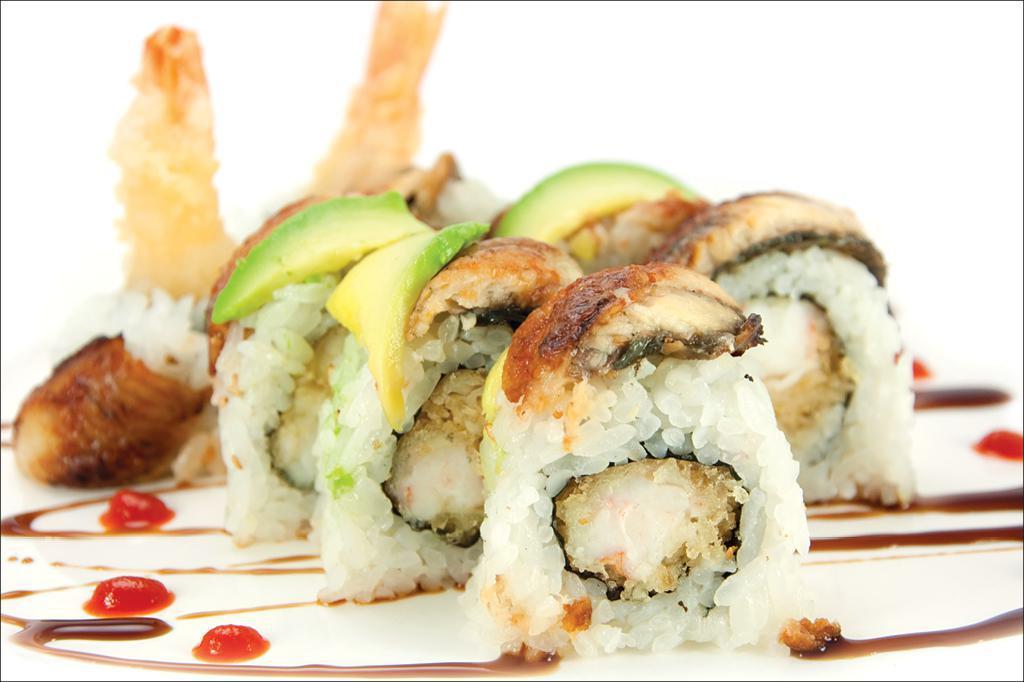 Black Dragon Roll · Shrimp tempura and cucumber inside and topped with eel and avocado. with tobiko