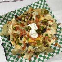 Black Angus Beef Nachos · Fried tortilla chips with queso, shredded jack, beef, pico, and sour cream.