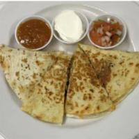 Broiled Quesadillas · Cooked tortilla that is filled with cheese and folded in half. 