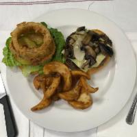 French Onion Burger · Grilled per your liking topped with caramelized onions, mushrooms with Swiss cheese.
