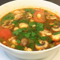 Tom Yum Soup · Choice of chicken or shrimp with mushrooms, tomatoes, lemongrass, lime leaves, and galangal ...