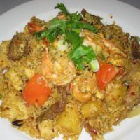 Pineapple Fried Rice · Jasmine rice stir-fried in yellow curry paste with tomatoes, onions, pineapples, cashews, ra...