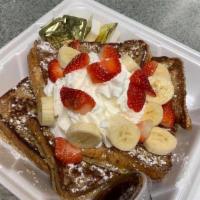 Country French Toast · 3 slices of French toast topped with fresh fruit and whipped cream.