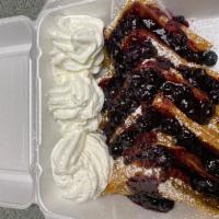 Blueberry French Toast · 3 slices of thick Texas French toast, topped with homemade blueberry compote and whipped cre...