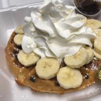 Chocolate chip Wafle · Homemade Belgian wafle filled with chocolate chip. Topped with fresh banana and whipped crea...