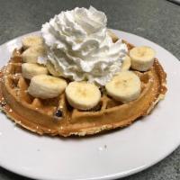 Blueberry Wafle · Homemade Belgian wafle filled with blueberry. Topped with fresh banana and whipped cream. Se...