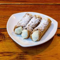 Cannoli  · Hand filled with chocolate chip sweet ricotta cream.