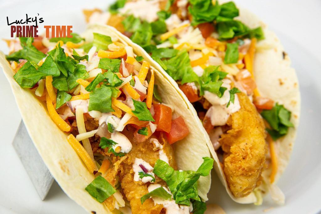 Fish Tacos  · 2 pieces. Fresh fried grouper, shredded cabbage, pico de gallo, mixed cheese and spicy cream sauce served with flour tortillas.