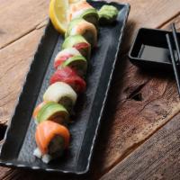 W242. Rainbow Roll · Crab meat and cucumber with avocado, tuna, salmon, shrimp and red snapper on top.