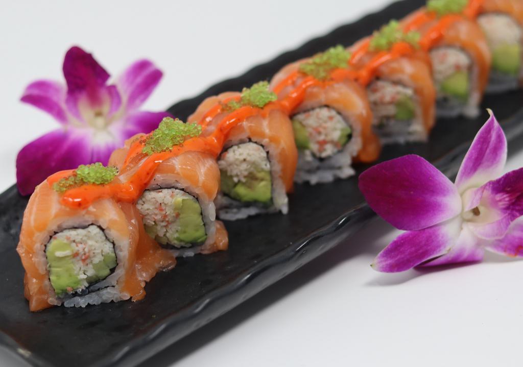 Sunset Roll · Crab meat, avocado and cucumber inside, fresh salmon with variety of tobiko and touch of spicy mayo.
