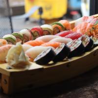 W263. Family Platter for 2 · 2 chef's  special rolls, 10 pieces sushi and 12 pieces sashimi. Served with choice of side.
