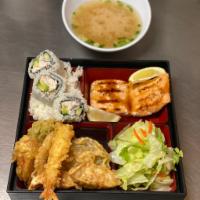 Salmon Bento Box · Salmon served with rice, 3 California roll, 5 tempura, salad and miso soup.