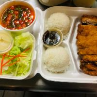 Orange Chicken Katsu · Orange chicken katsu served with steamed veggies and jasmine rice.
