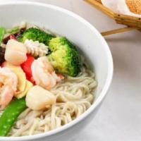C113. Seafood Noodle Soup · Savory light broth with noodles. 