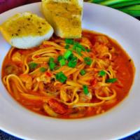 Shrimp ＆ Chicken Linguine · Shrimp ＆ Chicken cooked in a savory tomato cream sauce with green onion and mushroom, season...