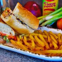 Jerk Chicken Po’ Boy · Chicken marinated in a blend of peppers, fruits and spices, then slow roasted and topped wit...