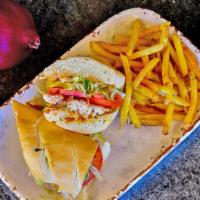 Catfish Po’ Boy · Catfish lightly breaded in Cajun style breading and deep fried to golden brown perfection, t...