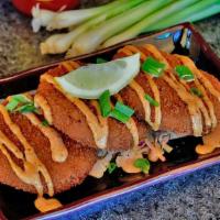 Crab Cakes · Three crab cakes fried and served with remoulade sauce.