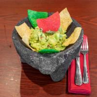 Guacamole · Mashed avocado, red onions, cilantro, lime, tomatoes and tortillas chips.
